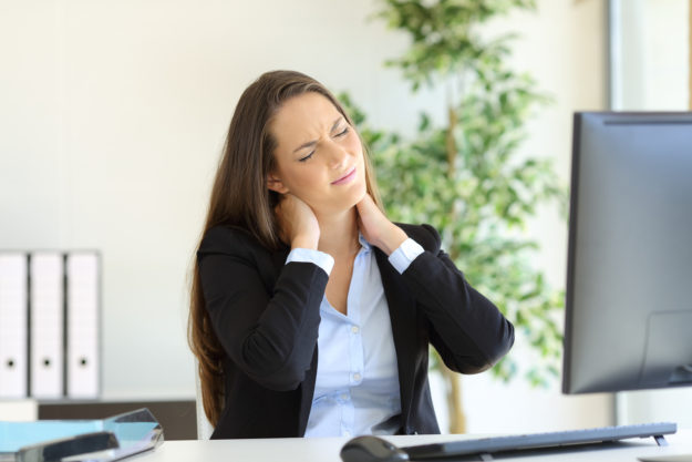 girl at desk with stiff neck