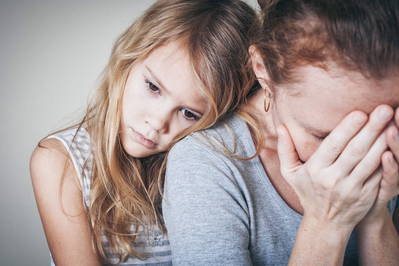 Sad Daughter Hugging Her Mother