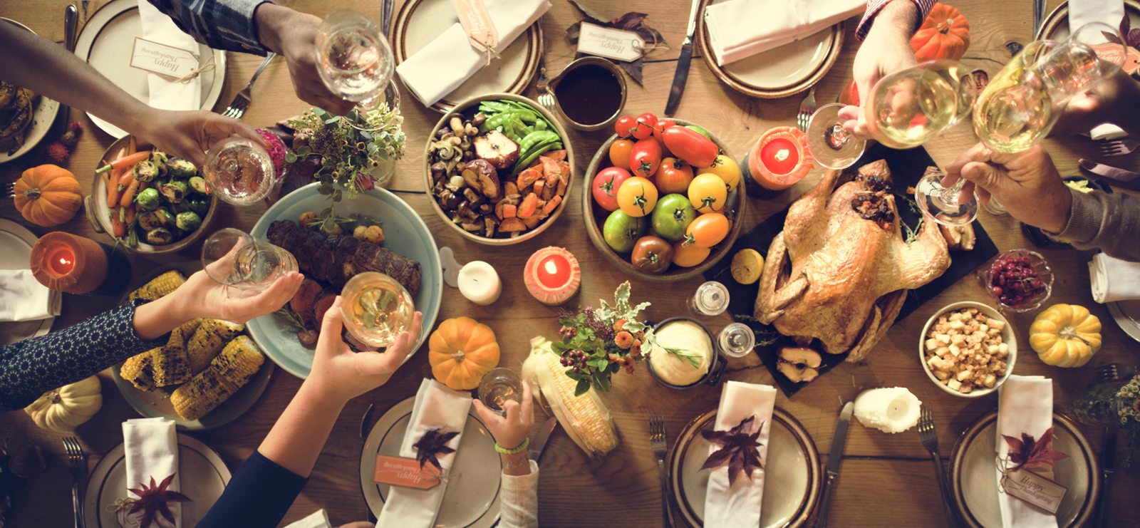 Thanksgiving table spread with a toast