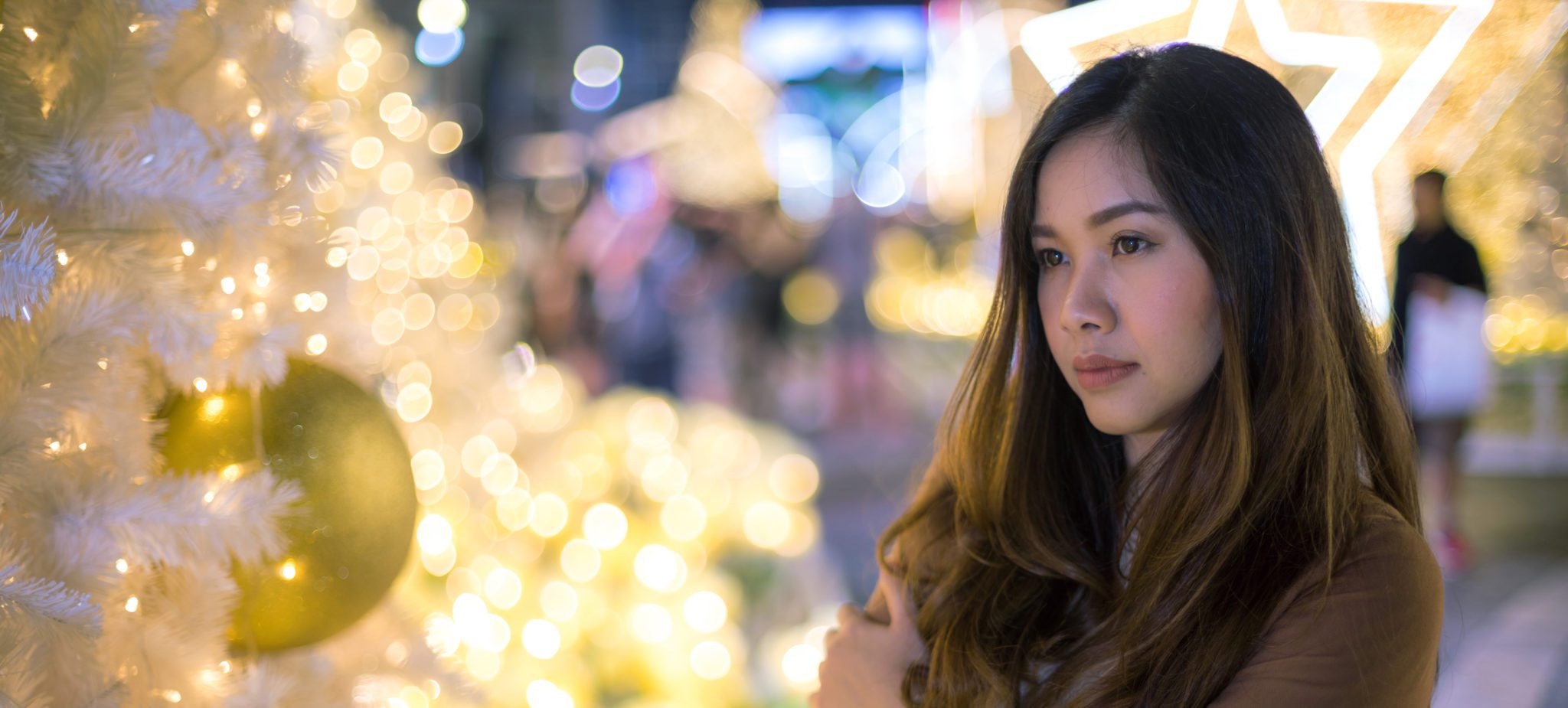 Portrait of lonely asian woman outdoor in night. Christmas and New Year concept