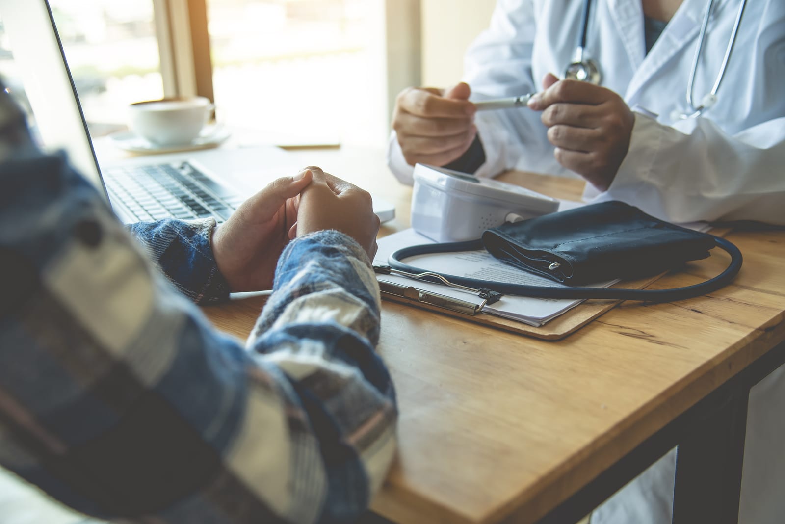 The doctor is discussing with the patient after a physical examination of the results and treatment guidelines.