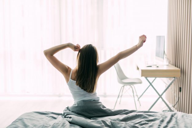 Woman waking up and starting her daily routine